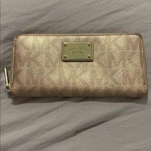 Michael kors Rose Gold MK signature wallet. Zip around. In great condition
